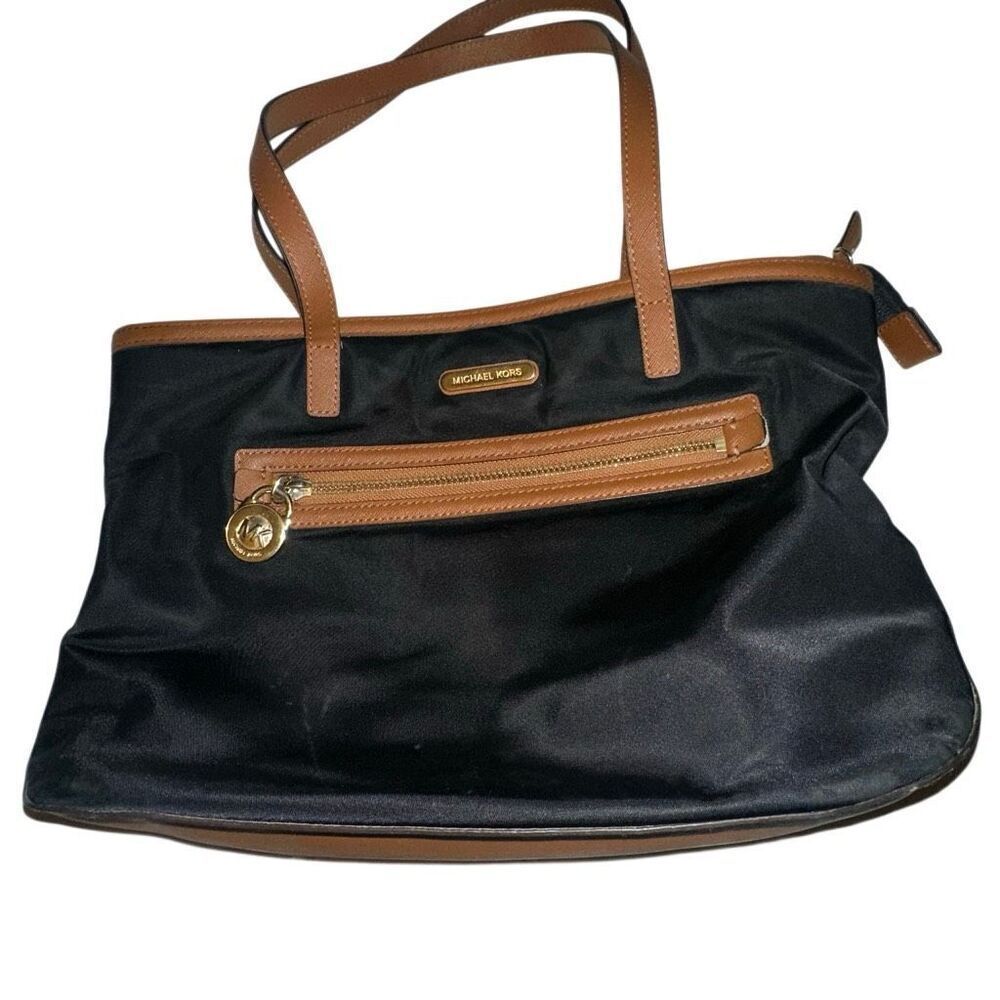 Michael kors black purse w/ tan trim 6 pockets